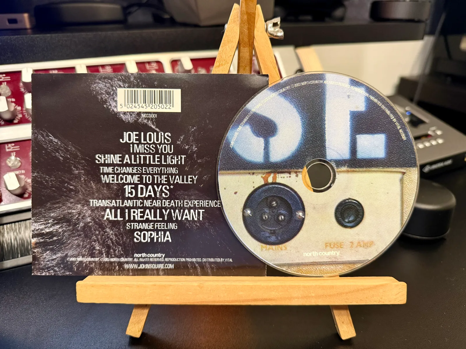The back of the slipcase showing the tracklist, with the disc beside it