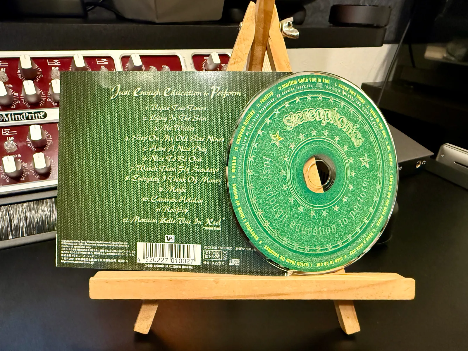 Back of the slipcase showing the tracklist, and the CD disc beside it