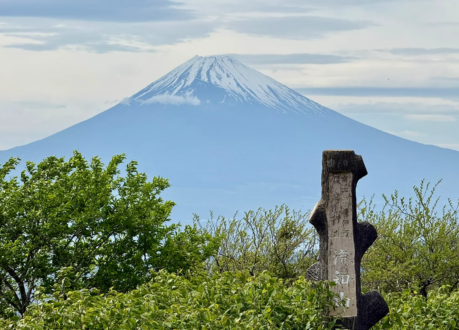 Mt. Fuji from Takichiyama Enchi, with a stone marker in the foreground